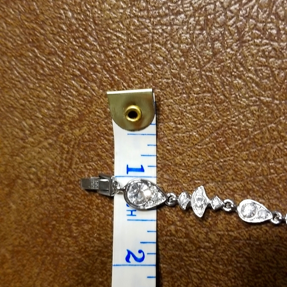 Givenchy silvertone and rhinestone tennis bracelet - Picture 7 of 7